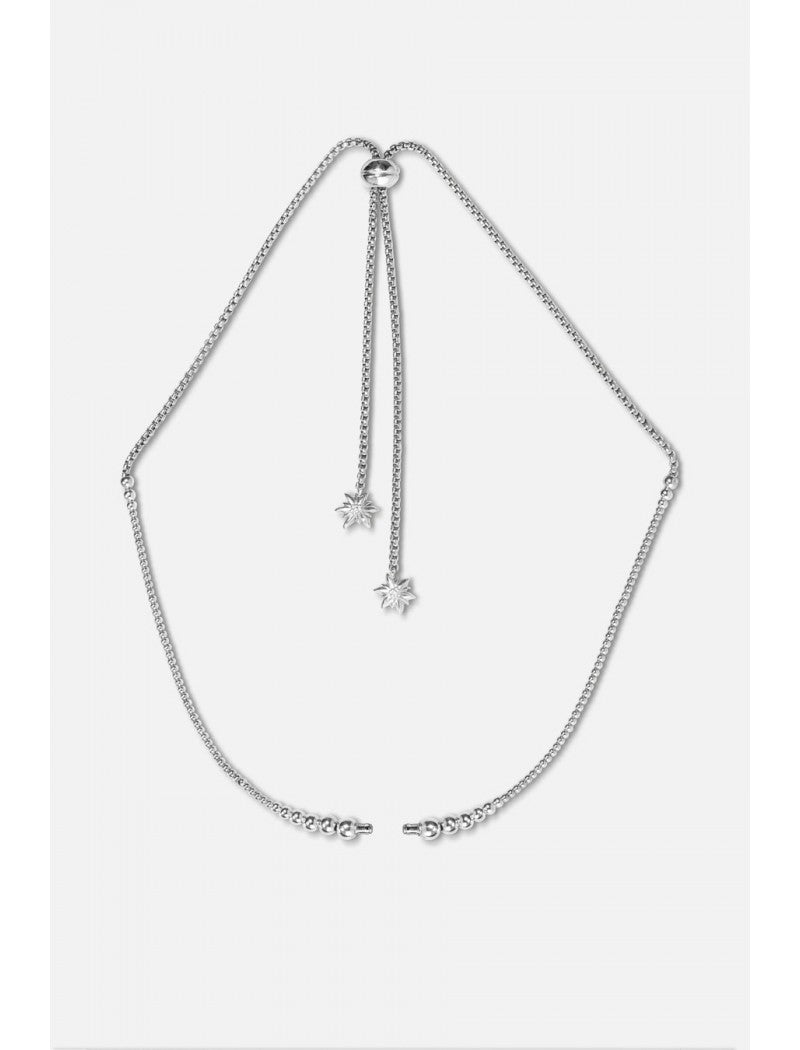 Collier Edelweiss en acier inoxydable, réglable en taille et recto-verso. Recto avec système de fermoir, verso avec décors fixes en laiton avec traitement de surface PVD.