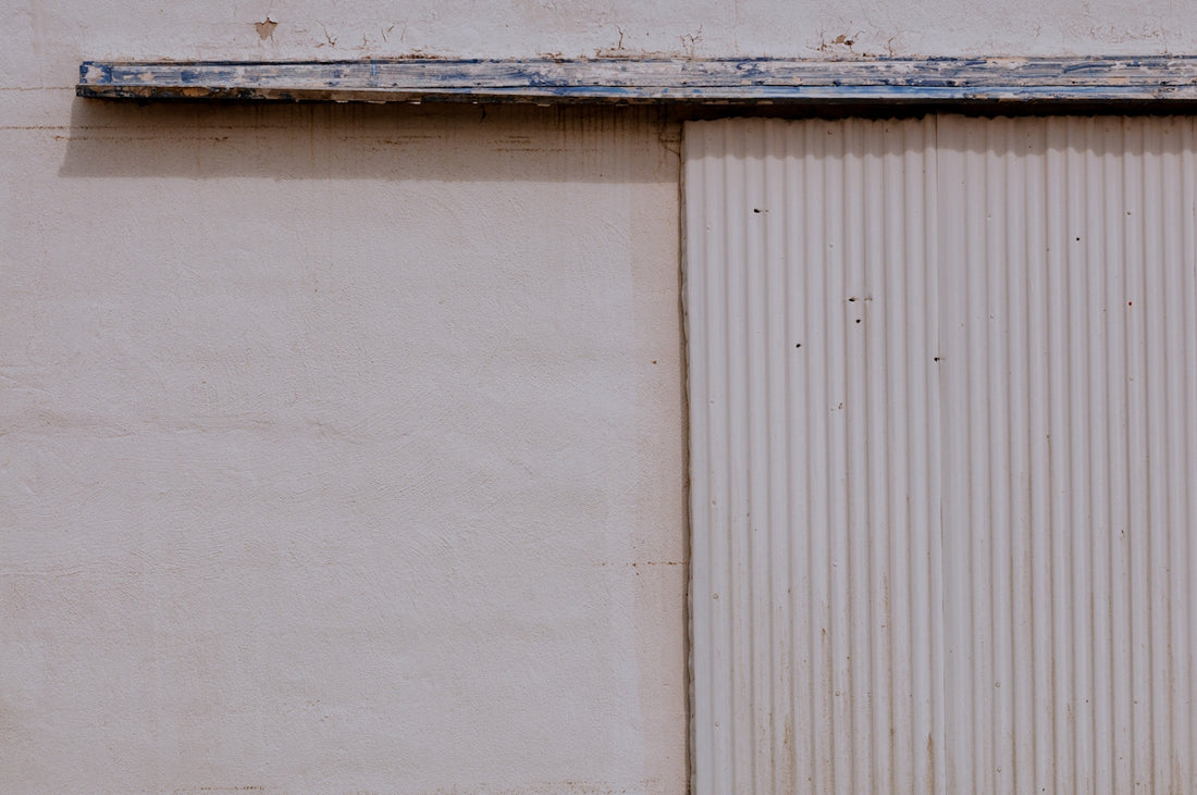 white wooden wall with white wooden door