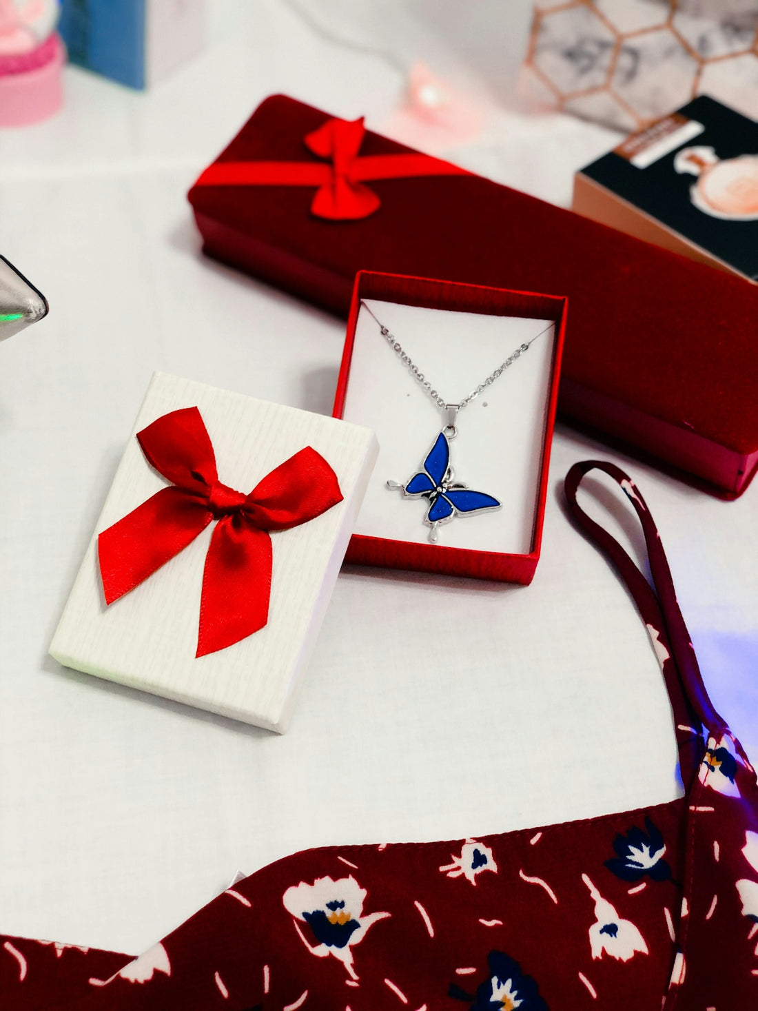 red and white gift box with red ribbon
